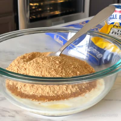 Ingredients for magic cookie bars in a glass bowl