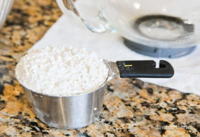 Measuring cup full of flour