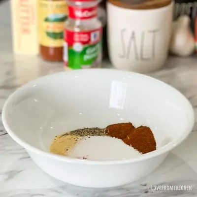 Seasoning for pork tenderloin in a white bowl