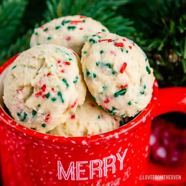 Close up of snowball cookies in a red mug