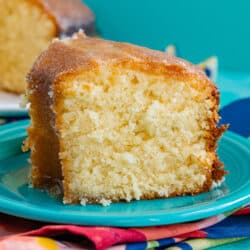 A slice of Kentucky butter cake on a blue plate.