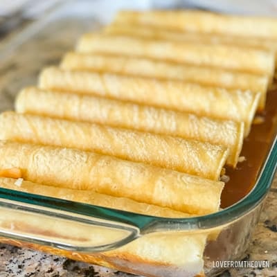 Several enchiladas in a glass baking pan