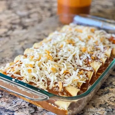 Cheese covered enchiladas in glass baking pan
