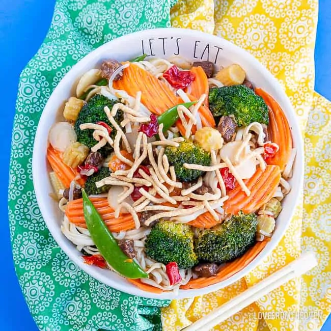 Bowl of chow mein with green and yellow napkins