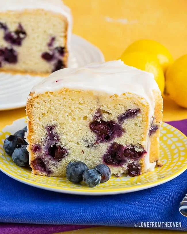 A piece of lemon blueberry cake on a plate,