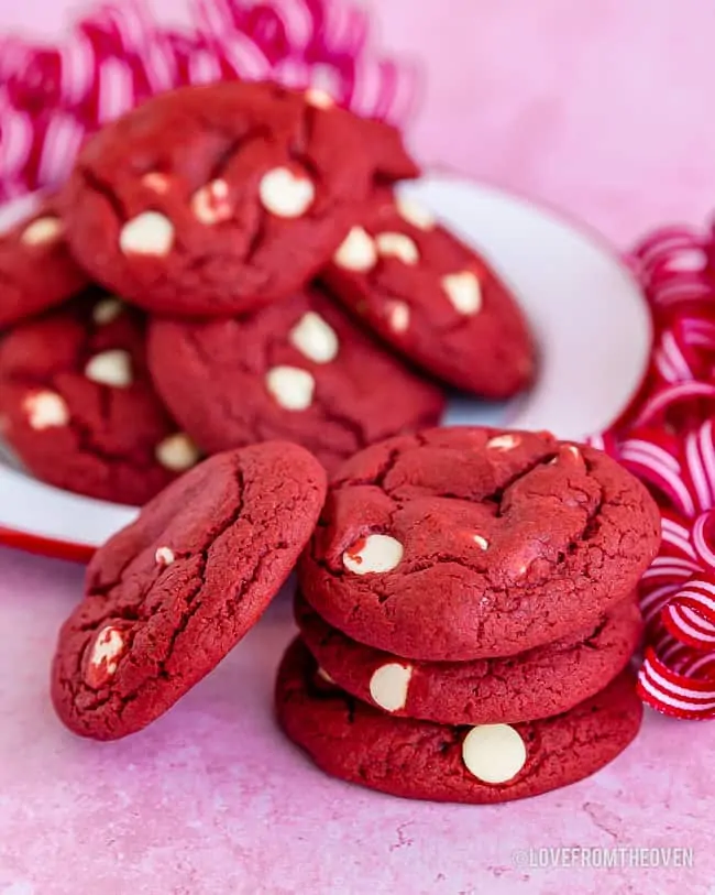 Multiple red velvet cookies with white chocolate chips
