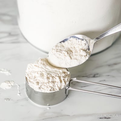 A measuring cup full of flour