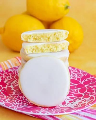 A stack of lemon cookies on a plate