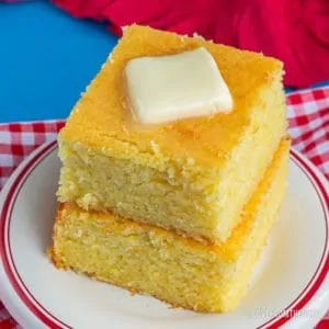 stack of cornbread topped with butter