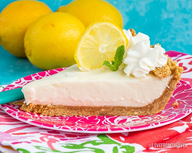 A slice of pie on a plate, with Lemon and Cream