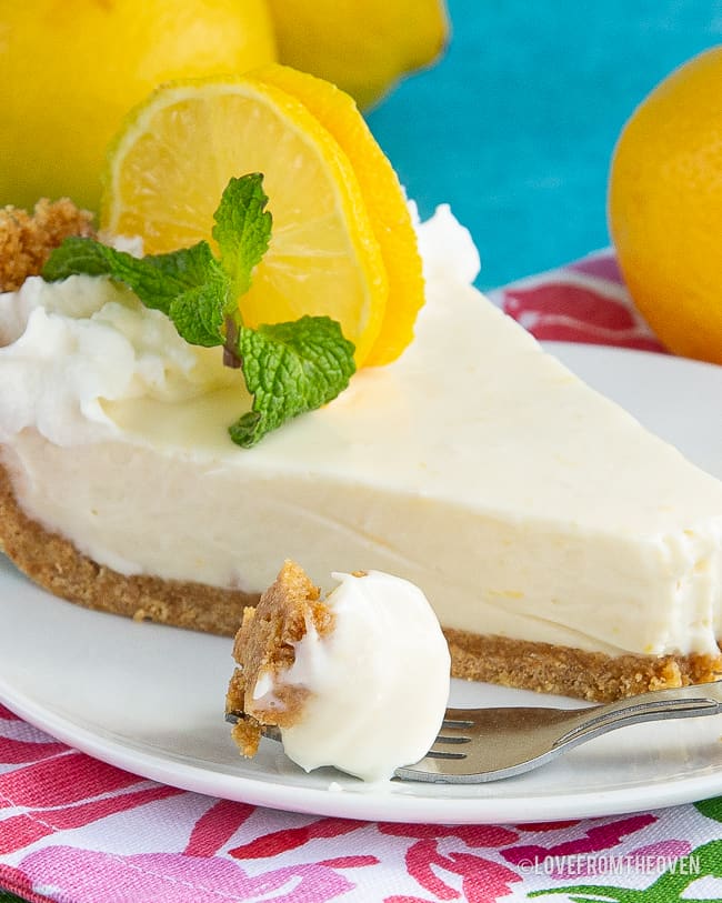 A plate of food with a slice of pie on a table