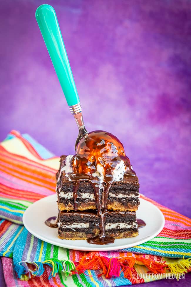 Brownies topped with ice cream on a plate