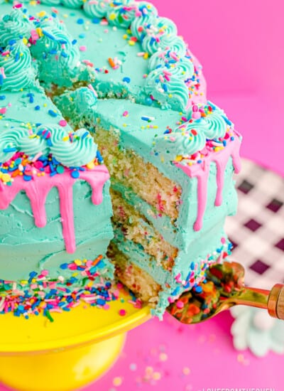 A funfetti cake being sliced