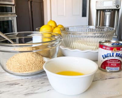 A bowl of food on a table, with Graham cracker and Lemon 