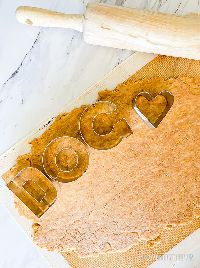 cookie cutters that spell dog on peanut butter dog treat dough