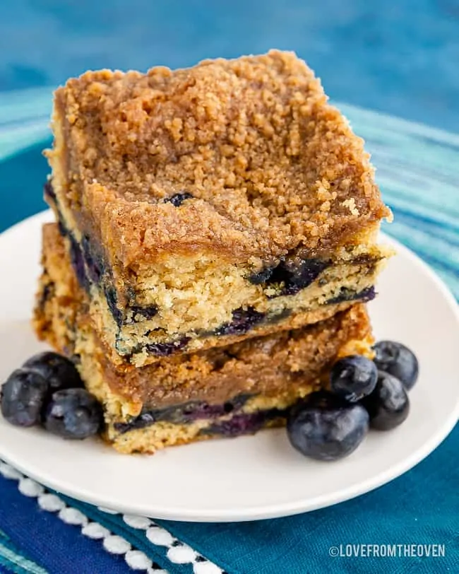 Two slices of blueberry buckle cake stacked on each other