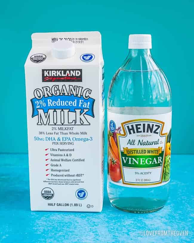 A carton of milk and a bottle of vinegar to make homemade buttermilk