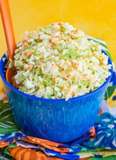 Bowl of KFC Coleslaw Recipe in a blue bowl with a yellow background