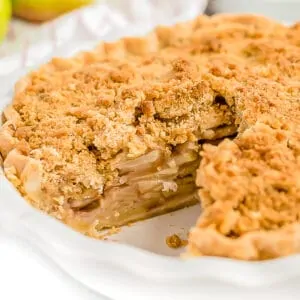 A Dutch apple pie with a slice cut out