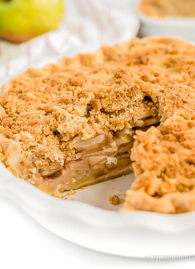 A Dutch apple pie with a slice cut out