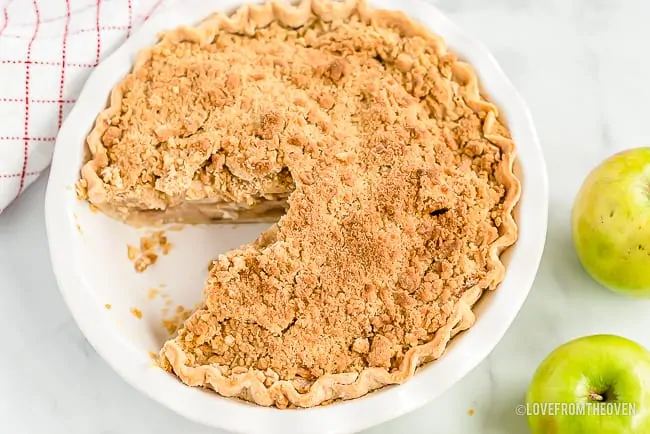 Apple Crumb Pie with one slice cut out