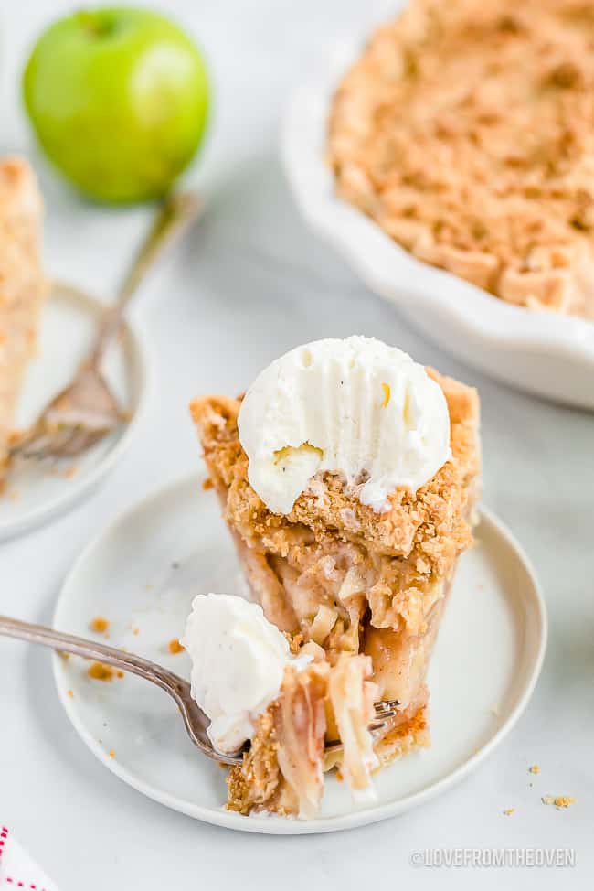 Slice of dutch apple pie with crumb topping