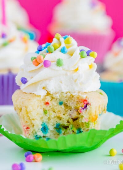 Picture of a funfetti cupcake with a bite taken out of it