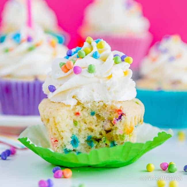 Picture of a funfetti cupcake with a bite taken out of it