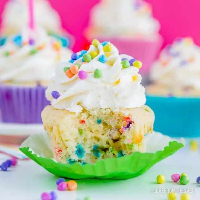 Picture of a funfetti cupcake with a bite taken out of it
