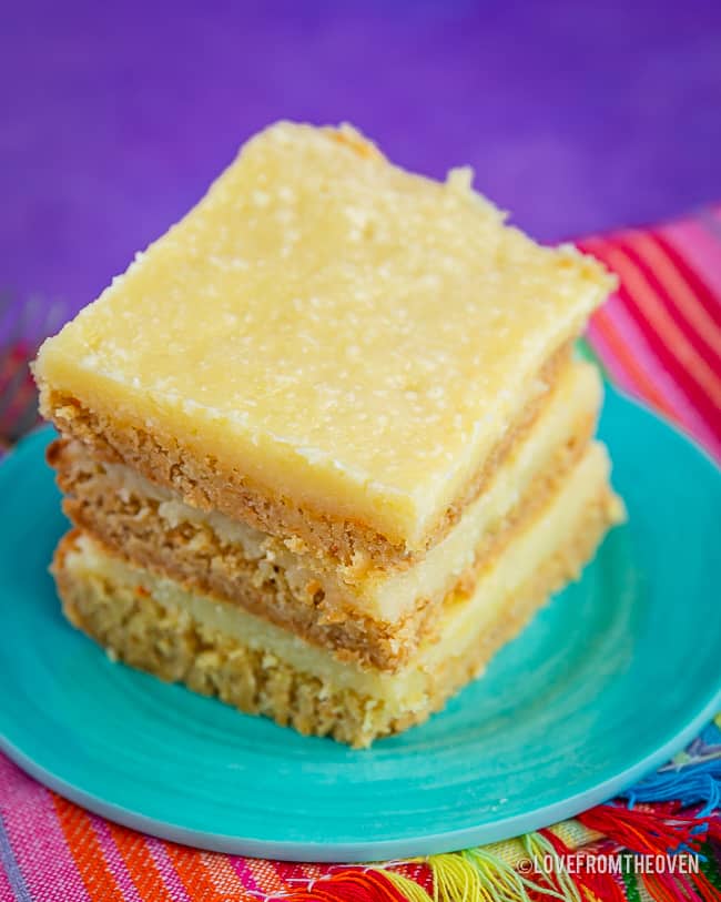 Three slices of gooey butter cake on a blue plate