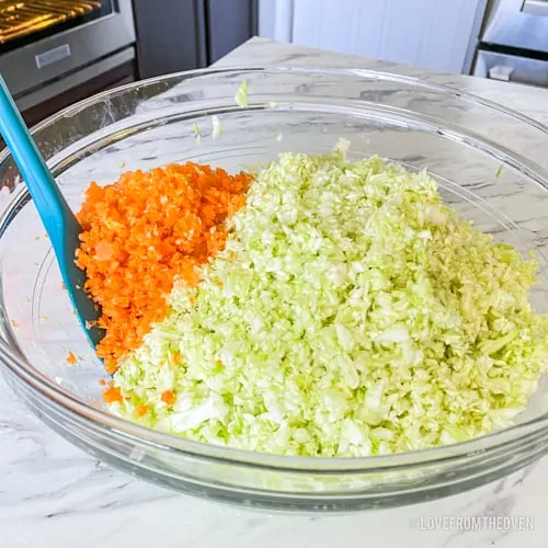 Bowl with cabbage and carrots to make KFC coleslaw at home