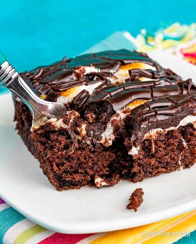 Slice of Mississippi Mud Cake with a fork taking a piece