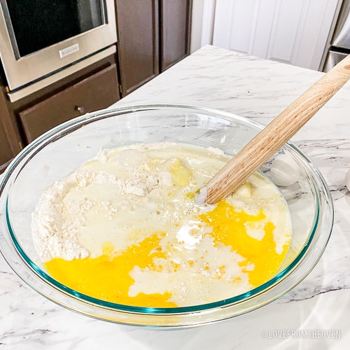 Bowl of ingredients to make blueberry pancakes