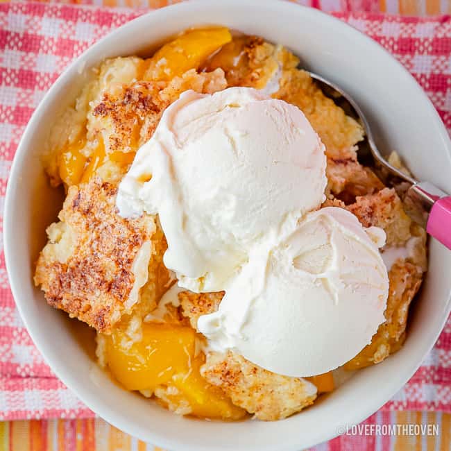 Peach cobbler cake in a bowl