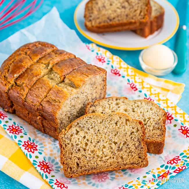 Loaf of banana bread cut into slices ready to serve