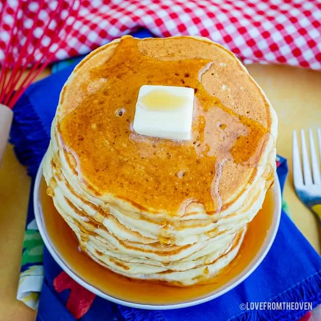 Overhead shot of pancakes topped with butter