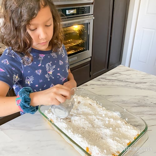 girl making peach dump cake