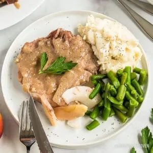 Plate with pork chops, green beans and potatoes