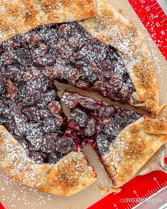 chocolate cherry galette being cut