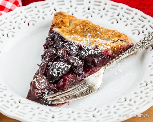 Slice of cherry galette on a plate