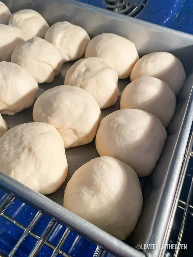 balls of bread dough in a pan