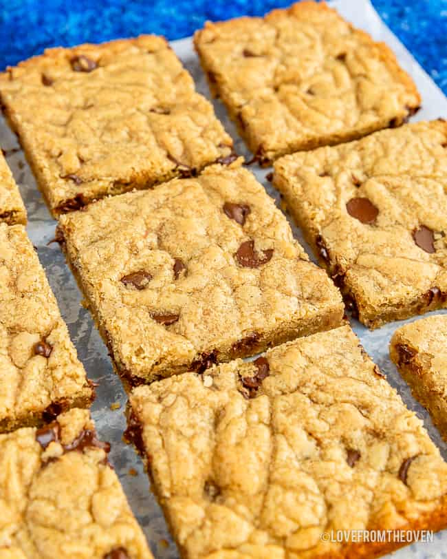 cut blondies sitting on wax paper