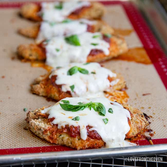 chicken parmesan on a baking sheet