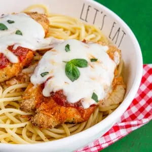 Chicken parmesan in a bowl with pasta