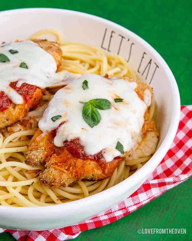 Chicken parmesan in a bowl with pasta