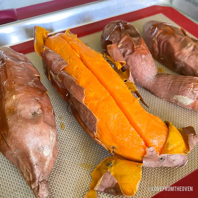 Baked sweet potatoes on a baking sheet