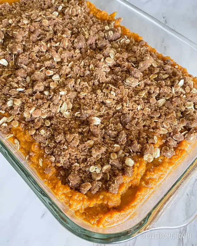 A pan of sweet potato casserole with topping