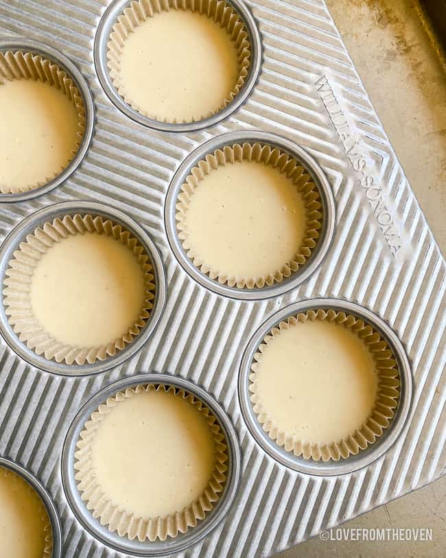 Cupcake pan with cupcake batter in it