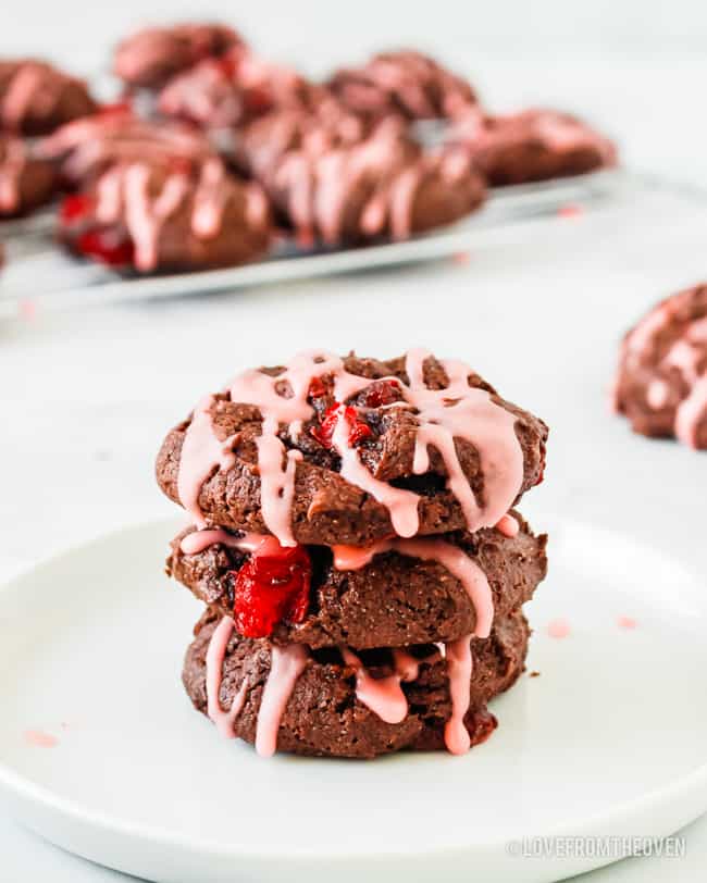 a stack of chocolate cookies with cherries