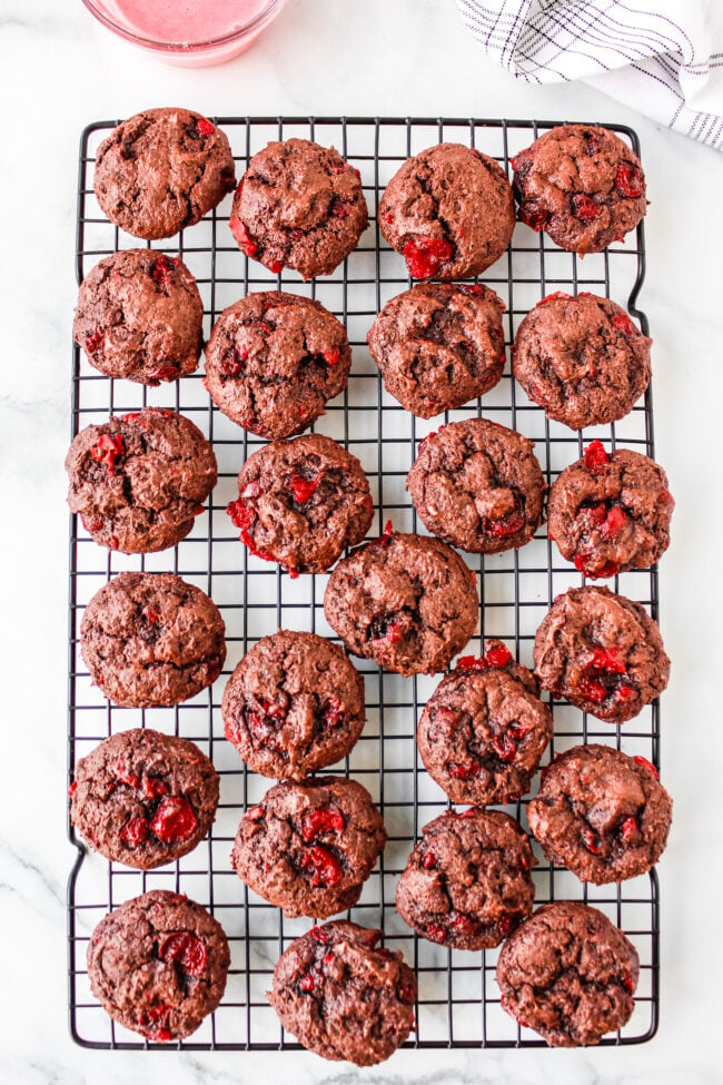 Chocolate cherry cookies on a cooling rack